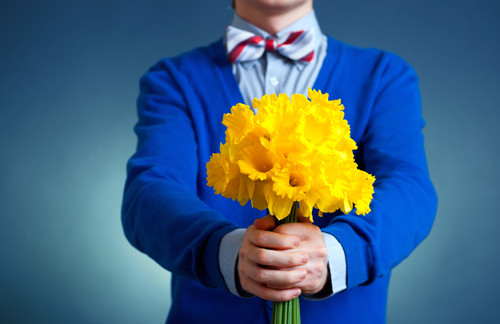 man holding a bouquet of flowers